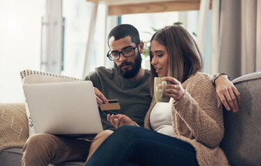 Poster - Dont sacrifice quality time, shop online. a young couple using a laptop and credit card on the sofa at home.