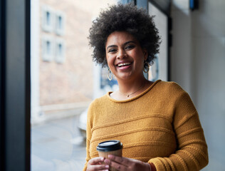 Aufkleber - Become your own role model in life. Portrait of an attractive young businesswoman drinking coffee and looking cheerful in her office at work.