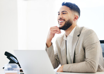 Aufkleber - Im so proud of myself. a handsome young businessman sitting alone in the office and using his laptop.