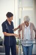 © D Laflor/peopleimages.com - Look how much progress youve made. a young female nurse assisting a senior woman walk using a walker in a nursing home.