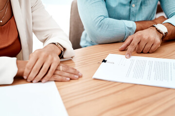 Poster - So I just sign here. two unrecognizable young business colleagues going over some documents in the boardroom.