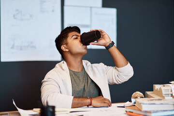 Poster - Its not caffeine, its a creativity boost. a young architect having a coffee break while working in a modern office.