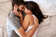 © Emil Lime/peopleimages.com - Who wouldnt want this forever. an affectionate young couple embracing in bed at home.