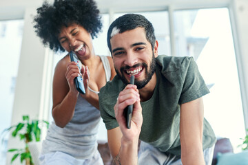 Poster - We learned how to entertain ourselves while staying in. a couple having a sing along at home.