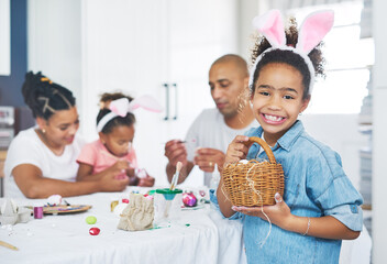 Canvas Print - I am only passionately curious. a mother and father painting eggs with their daughter at home.