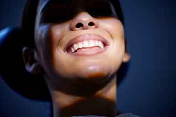 Poster - Dental work done right leaves a smile thats super bright. a young woman having a dental procedure performed on her.