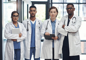 Poster - The medical field is amazing. a group of doctors standing in a row together at work.