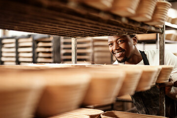 Poster - Its time to get these into the oven. a male baker pushing a baking trolley.