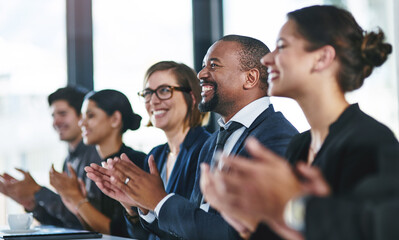 Poster - Theyre really impressed. a diverse group of young businesspeople applauding during a conference.