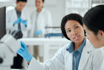 Poster - I cant do this alone. two scientists helping one another in the lab.