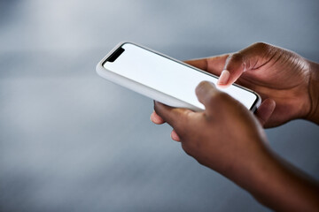 Poster - This app could be of great use. an unrecognizable woman using her cellphone at the gym.