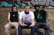 Graffiti, teenager and portrait of friends on bench for hip hop, street art and music. Fashion, happy and urban with group of men with headphones in park for grunge, diversity and gangster style
