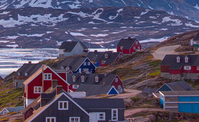 Wall Mural - Picturesque village on coast of Greenland - Colorful houses in Tasiilaq, East Greenland