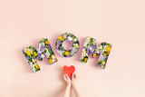 Fototapeta Kawa jest smaczna - Mother's day card. Boxes In Form Of MOM Word Filled With Flowers.