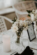 Indoor white wedding reception floral centre piece