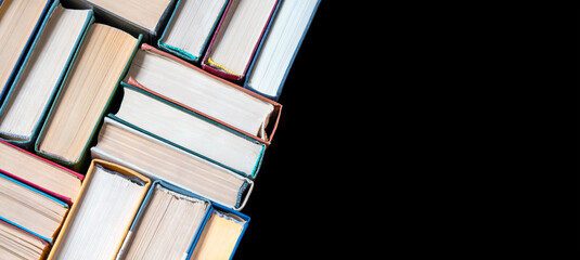 Banner with book stacks on black. Copy space. Abstract pattern. Education background. Back to school concept