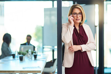 Poster - On hold with a potential client. a beautiful young businesswoman on a call in the workplace.