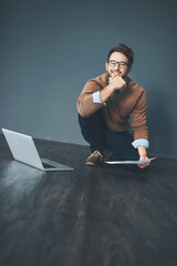 Aufkleber - How you approach work is up to you. Studio shot of a young businessman working on a laptop against a grey background.