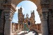 Couple of travelers enjoy the views of a castle in Benalmadena, Malaga, Spain