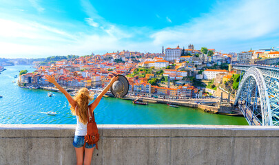 Wall Mural - happy traveler woman in porto- cityscape panoramic view of porto- portugal