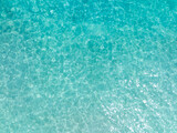 Fototapeta Kawa jest smaczna - Aerial view of the Overhead view of crystal clear water on beach background