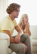 © T Rose/peopleimages.com - Regretting what he said. A young couple reflecting on a disagreement thats just taken place.