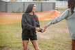 © Austockphoto - Two Aboriginal teen girls playing together outside