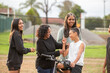 © Austockphoto - Aboriginal family laguhing and talking outside