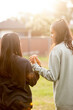 © Austockphoto - Two Aboriginal young women walking together