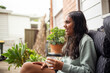 © Austockphoto - Aboriginal young woman holding glass of drinking water outside