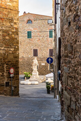 Wall Mural - Picturesque Garibaldi Square with Italian general Giuseppe Garibaldi statue, historical center of Scarlino, little medieval town in the province of Grosseto, Tuscany region, Italy