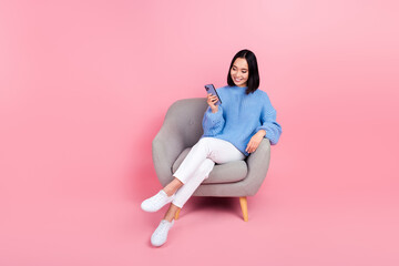 Canvas Print - Full body photo of charming nice lady sit chair use smart phone isolated on pink color background