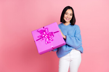 Poster - Photo of cheerful gorgeous girl arms hold receive giftbox toothy smile isolated on pink color background