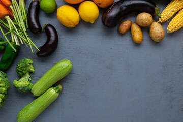 Wall Mural - Food background with zucchini potatoes corn cob copy space