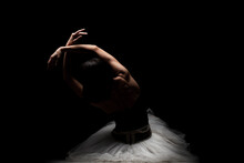 Half Silhouette Modern Ballet Dancer. Balerina Posing On Dark Background
