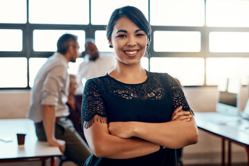 Poster - Nothing makes me happier than a productive team. Portrait of a confident young businesswoman standing in a modern office with her colleagues in the background.