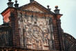 Closeup shot of writings on the top of the Basilica of Bom Jesus monument in Goa, India. Ancient church built by Portuguese at Panaji in North Goa. UNESCO world heritage site of Goa.	