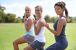 © Hova/peopleimages.com - Sunshine and exercise. a group of young women exercising outdoors.