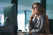 © Jadon Bester/peopleimages.com - Putting her mind to completing the deadline. a young businesswoman working late on a computer in an office.