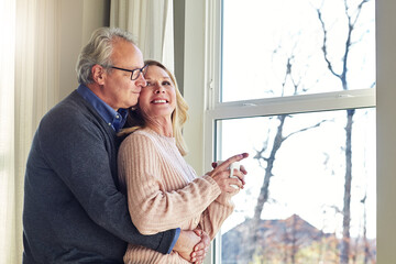 With you I am home. an affectionate senior married couple spending time together at home.