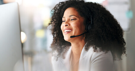 Wall Mural - Happy female customer service agent smiling while working in a call centre, talking to a client with a headset. A helpful saleswoman assisting customers with purchase orders and questions online