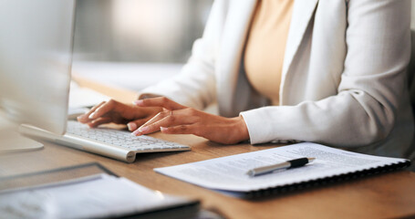 Poster - Closeup of the hands of a receptionist typing and sending emails while working in an office alone. One secretary doing admin and writing reports while organizing a schedule for her manager at work
