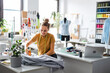 © pikselstock - Young fashion designer working at her workplace