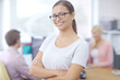 © Grady R/peopleimages.com - Ill lead this team to success. Portrait of an attractive young brunette businesswoman with her colleagues in the background.