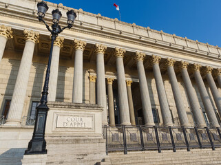 Wall Mural - Court of appeal in old Lyon district, iconic neo-classical  building, lamppost, stone marking 