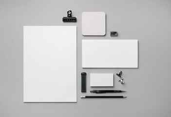 Wall Mural - Blank corporate identity template. Photo of blank stationery set on gray paper background. Flat lay.