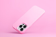 IPhone 14 Pro Max And 13 In Pink Soft Silicone Case Falls Down Back View, Phone Case Mockup In Monochrome Colours Isolated On Pink Background