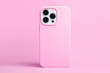 © iso100production - pink phone case mockup. iPhone 14 pro max and 13 mock up back view isolated on monochrome color background