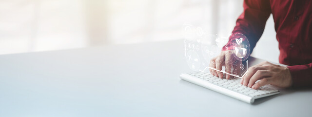 Person typing on keyboard with eco hologram, using technology in conjunction with global ecological preservation to reduce the use of natural resources, destroy nature and create global warming.