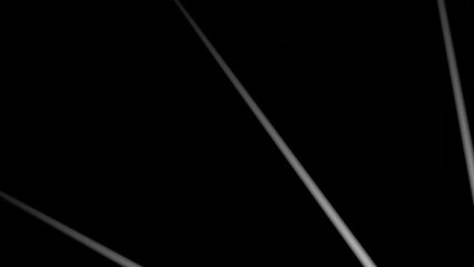 Poster - Abstract rays and flying tubes on a black background. Design. Colorful narrow rays becoming tubes.